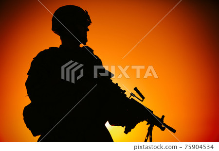 Silhouette of soldier with machine gun on shore Silhouette of soldier with machine gun on shore 75904534