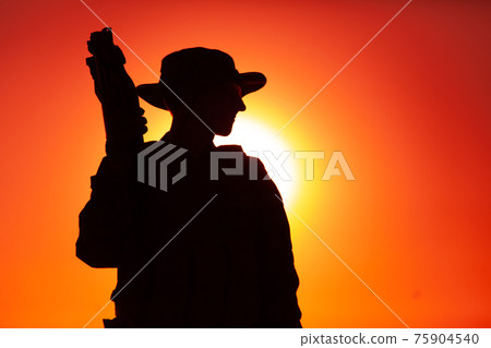 Special forces soldier on sunset background 75904540