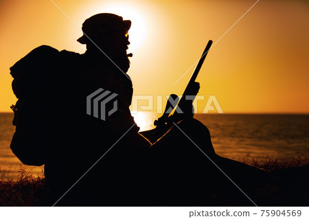 Army elite forces, coat guard sniper on sea shore Army elite forces, coat guard sniper on sea shore 75904569