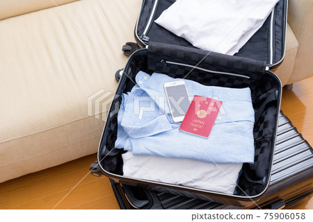 Preparation for overseas travel, unpacking carry bag and passport 75906058