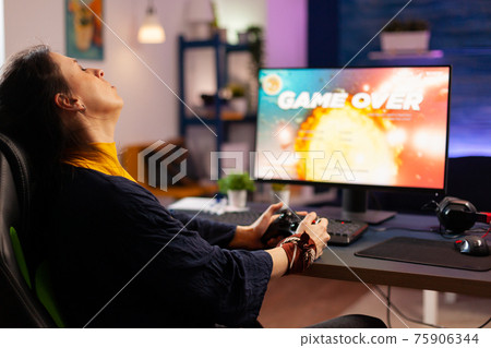 Player woman winning space shooter game Player woman winning space shooter game 75906344