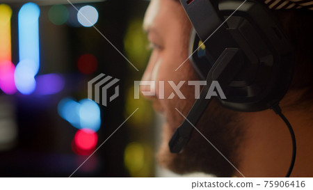 Close up of pro man streaming FPS shooter video game 75906416