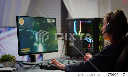 Excited professional esport gamer celebrating championship victory 75906447