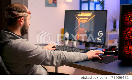 Caucasian man playing online video games for virtual championship 75906481