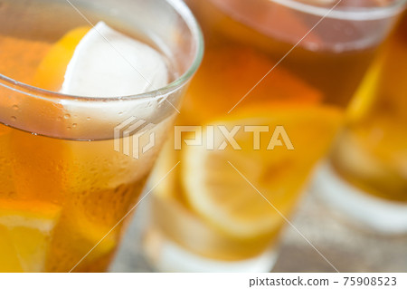 Fresh ice tea on wooden table Fresh ice tea on wooden table 75908523