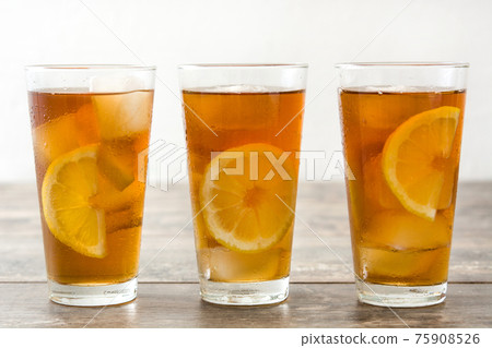 Fresh ice tea on wooden table Fresh ice tea on wooden table 75908526