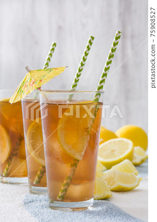 Fresh ice tea on wooden table Fresh ice tea on wooden table 75908527