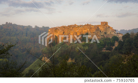 Dawn over the medieval commune town of Calcata in Italy populated by artists and hippies in 1960 75910705