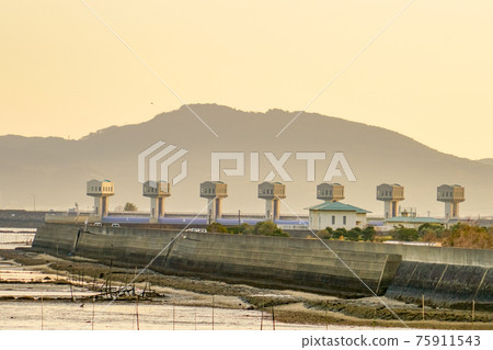 Isahaya Bay Reclamation Embankment at dusk 75911543