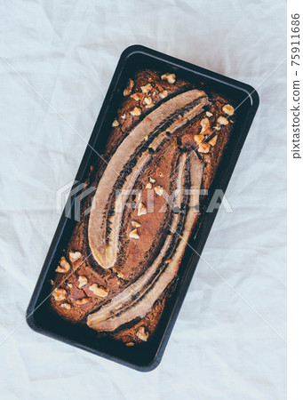 Freshly baked homemade gluten free banana bread cake. Freshly baked homemade gluten free banana bread cake. 75911686