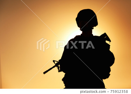 Silhouette of army infantryman with service rifle 75912358