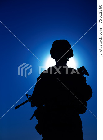 Night silhouette of army infantry soldier with gun 75912360