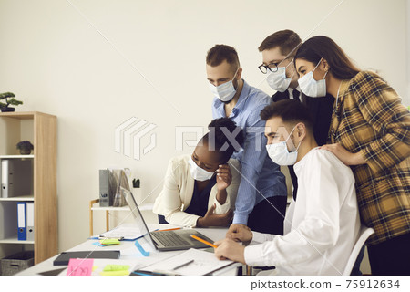 Business team in face mask have remote conversation on laptop with company staff Business team in face mask have remote conversation on laptop with company staff 75912634