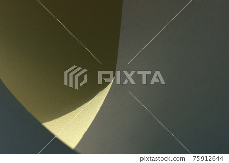 Macro image of green, blue and yellow paper with shadow effect and selective focus. 75912644