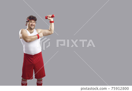 Smiling chubby guy holding dumbbell and flexing arm isolated on copyspace background Smiling chubby guy holding dumbbell and flexing arm isolated on copyspace background 75912800