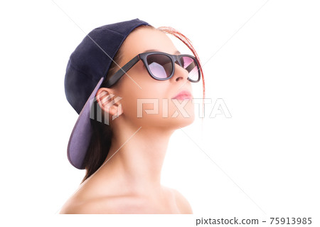 Beautiful stylish girl with backwards snapback cap and sunglasses Beautiful stylish girl with backwards snapback cap and sunglasses 75913985