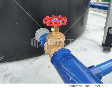 SEREMBAN, MALAYSIA -JUNE 2, 2021: Wheel type brass stop cork valve. Its help to control the entry of water into the piping system from one place to another. It will make it easier for maintenance work SEREMBAN, MALAYSIA -JUNE 2, 2021: Wheel type brass stop cork valve. Its help to control the entry of water into the piping system from one place to another. It will make it easier for maintenance work 75913990