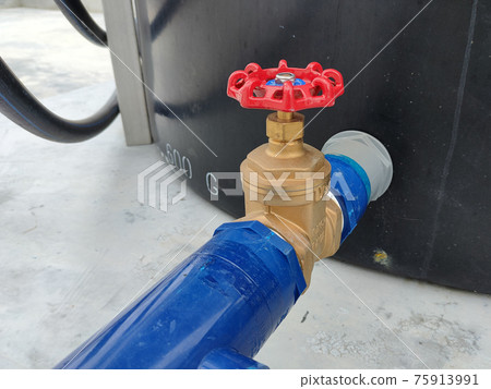SEREMBAN, MALAYSIA -JUNE 2, 2021: Wheel type brass stop cork valve. Its help to control the entry of water into the piping system from one place to another. It will make it easier for maintenance work SEREMBAN, MALAYSIA -JUNE 2, 2021: Wheel type brass stop cork valve. Its help to control the entry of water into the piping system from one place to another. It will make it easier for maintenance work 75913991