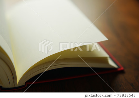 Turn a book on a bright background Turn a book on a bright background 75915545