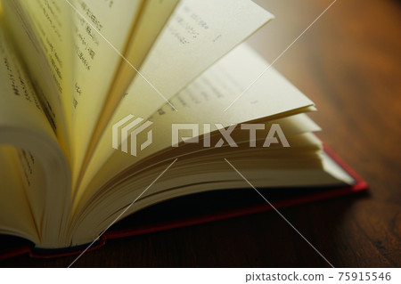 Turn a book on a bright background Turn a book on a bright background 75915546