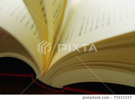 Turn a book on a bright background 75915557