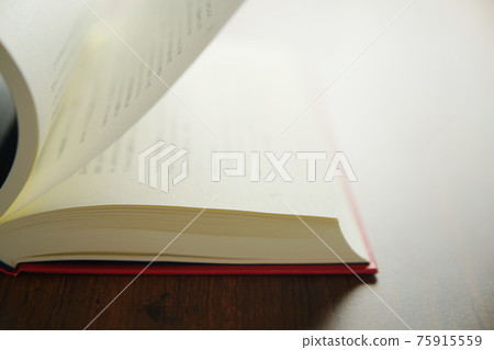 Turn a book on a bright background Turn a book on a bright background 75915559