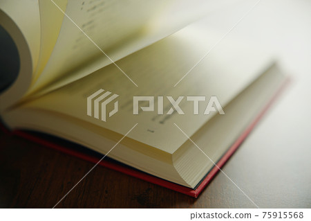 Turn a book on a bright background 75915568