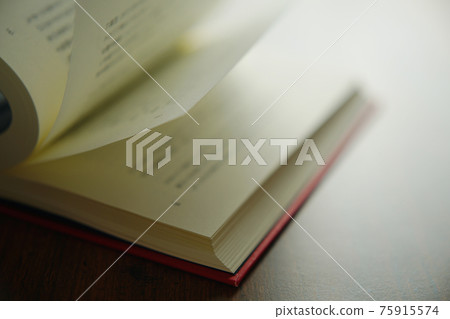 Turn a book on a bright background 75915574
