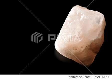 Photographed a mass of pink rock salt on a black background Photographed a mass of pink rock salt on a black background 75916165