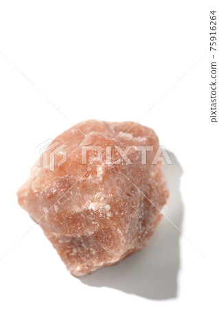Photographed a mass of red rock salt on a white background Photographed a mass of red rock salt on a white background 75916264