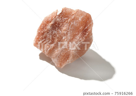 Photographed a mass of red rock salt on a white background Photographed a mass of red rock salt on a white background 75916266