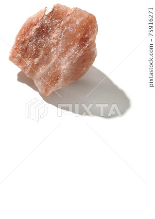 Photographed a mass of red rock salt on a white background Photographed a mass of red rock salt on a white background 75916271