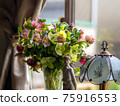 Bouquet of Christmas roses in a vase 75916553