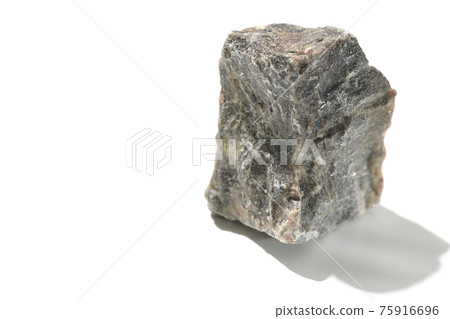 Photographed a mass of black rock salt on a white background Photographed a mass of black rock salt on a white background 75916696