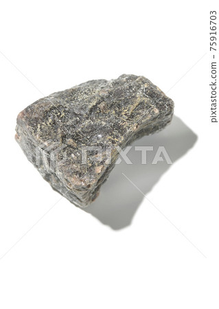 Photographed a mass of black rock salt on a white background 75916703
