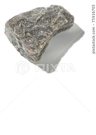 Photographed a mass of black rock salt on a white background Photographed a mass of black rock salt on a white background 75916705