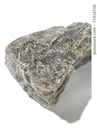 Photographed a mass of black rock salt on a white background Photographed a mass of black rock salt on a white background 75916706