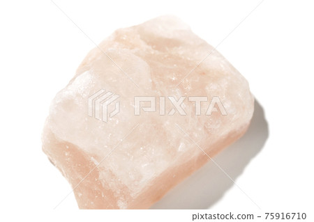 Photographed a mass of pink rock salt on a white background Photographed a mass of pink rock salt on a white background 75916710