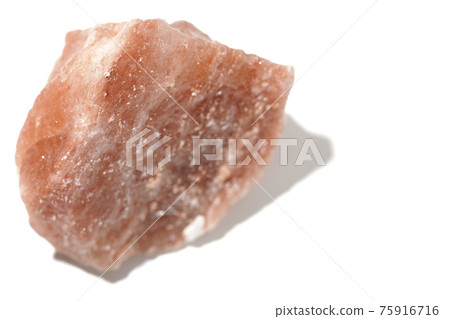 Photographed a mass of red rock salt on a white background Photographed a mass of red rock salt on a white background 75916716