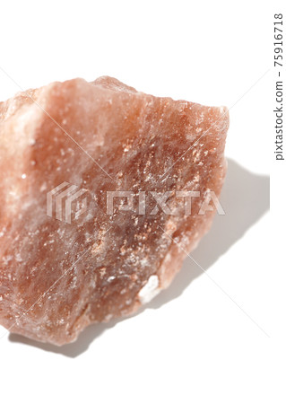 Photographed a mass of red rock salt on a white background Photographed a mass of red rock salt on a white background 75916718