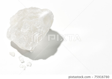 Photographed a block of rock salt that is as clear as crystal on a white background 75916780