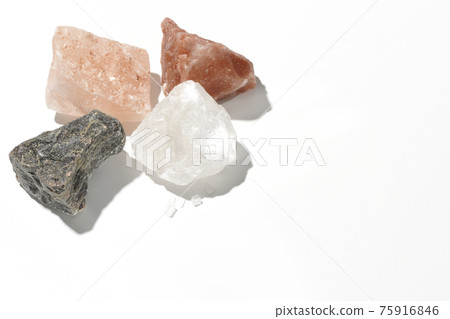 Shooting rock salt lumps of various colors on a white background Shooting rock salt lumps of various colors on a white background 75916846