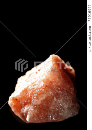 Photographed a mass of red rock salt on a black background Photographed a mass of red rock salt on a black background 75916963
