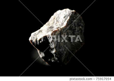 Photographed a mass of black rock salt on a black background Photographed a mass of black rock salt on a black background 75917054