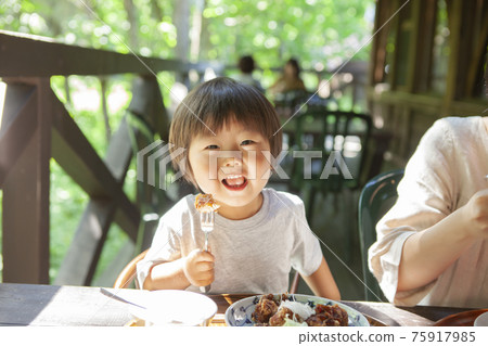 Parents and children enjoying lunch on the open deck 75917985