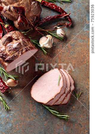Smoked ham with rosemary, garlic, and red pepper. Smoked ham with rosemary, garlic, and red pepper. 75923036