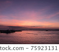 Purple and pale orange sunset 75923131