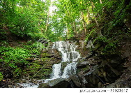 small waterfall of mountain river 75923647
