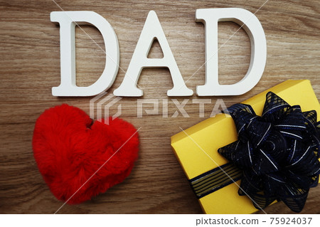 Happy Father's Day concept with DAD alphabet letter with space copy on wooden background 75924037