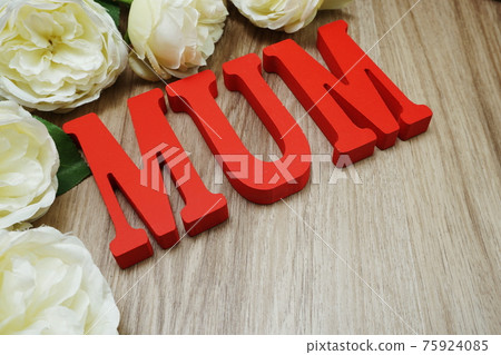 Mother's day with mum alphabet letter on wooden background Mother's day with mum alphabet letter on wooden background 75924085